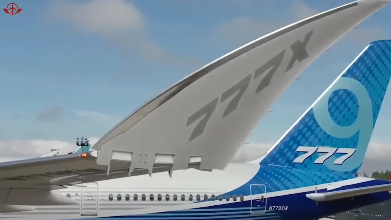 Folded 777X wingtip above the tail with 777X markings visible