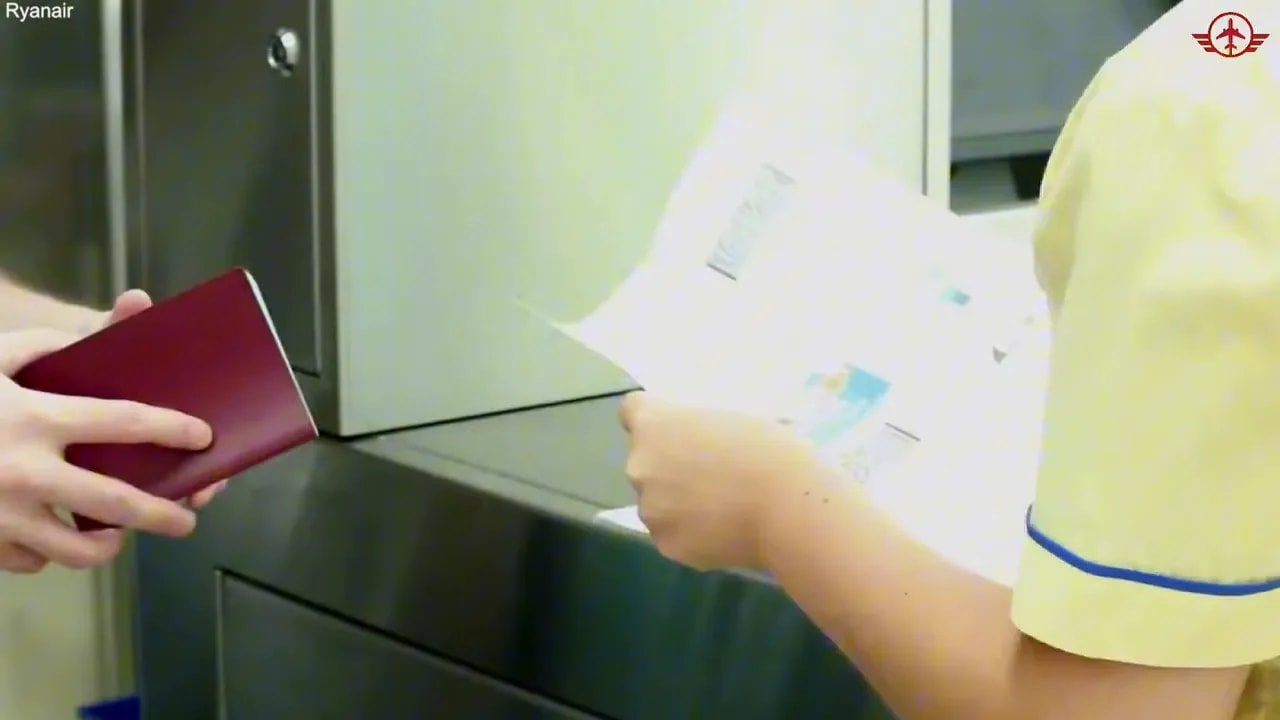 Airport check-in counter with staff handling boarding documents and passport
